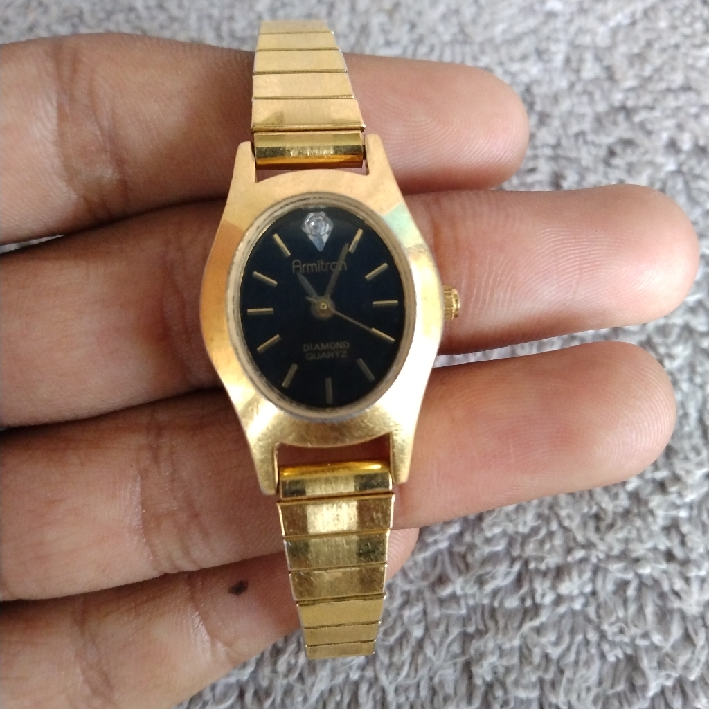 Armitron Gold Tone With Black Dial Womens Watch On Stretch Bracelet